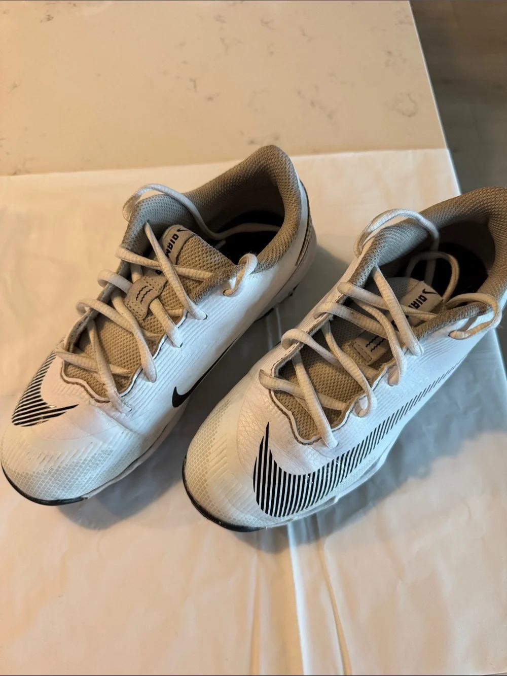 Nike White Kids baseball cleats with Black Swoosh Accents